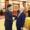 El secretario general del Partido Comunista de Vietnam, Nguyen Phu Trong, y el máximo dirigente del Partido Popular Revolucionario de Laos, Thongloun Sisoulith. (Foto: VNA)