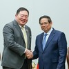 El primer ministro de Vietnam, Pham Minh Chinh, recibe a Thammasak Sethaudom, presidente y director ejecutivo del Grupo SCG. (Foto: Nhan Dan)