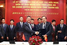 En la firrma de la Carta de Intención (CDI) entre Long An y Qinghai para establecer lazos de amistad entre ambas localidades. (Foto: VNA)