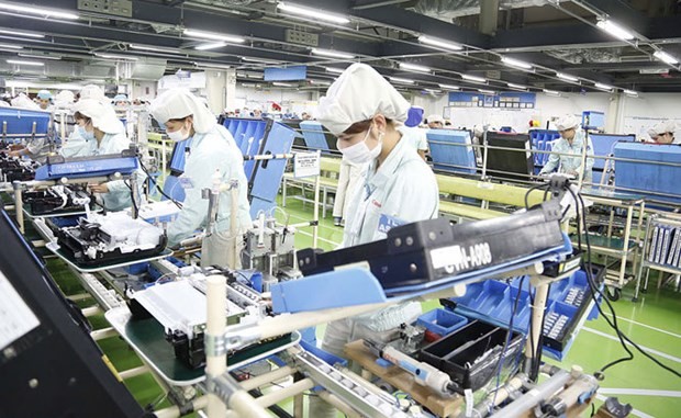 Línea de producción de impresoras en Canon Vietnam, una de las empresas con capital de inversión de Japón. (Fotografía: hanoimoi.com.vn)