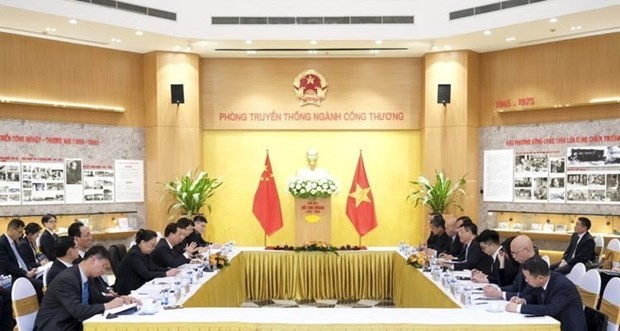 Delegados de Vietnam y China en la reunión. (Fotografía: VNA)