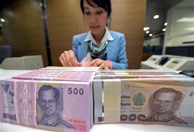 En un banco de Bangkok. (Fotografía: AFP/VNA)