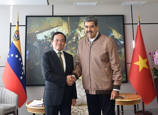 El viceprimer ministro vietnamita Tran Luu Quang y el presidente de Venezuela, Nicolás Maduro Moros. (Fotografía: VNA)