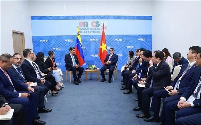 El primer ministro de Vietnam, Pham Minh Chinh, y el presidente de Venezuela, Nicolás Maduro. (Fotografía: VNA)