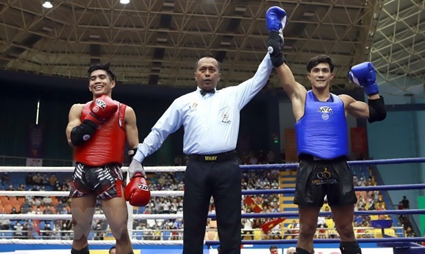 Nguyen Tran Duy Nhat, el campeón mundial de Muay Thai, ahora asistente del entrenador del equipo vietnamita Kum Khmer en los SEA Games 32. (Fotografía: VNA)