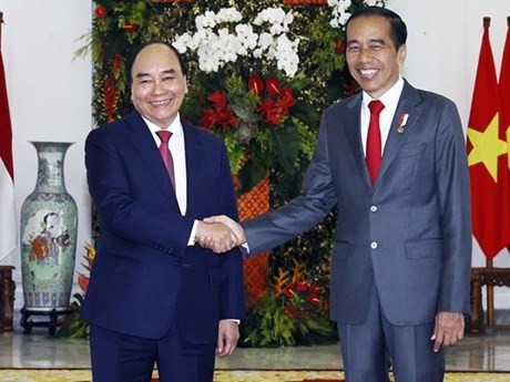 El presidente vietnamita, Nguyen Xuan Phuc, y su homólogo indonesio, Joko Widodo, (Fotografía: VNA)