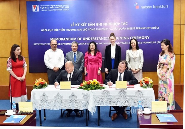 Acto de firma del acuerdo (Foto: congthuong.vn)