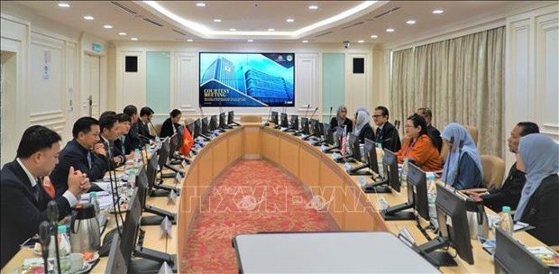 Escena de la reunión (Foto: VNA)