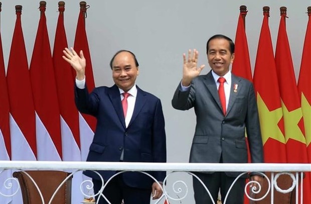 El presidente vietnamita, Nguyen Xuan Phuc (izquierda), y su homólogo indonesio, Joko Widodo. (Fotografía: VNA)