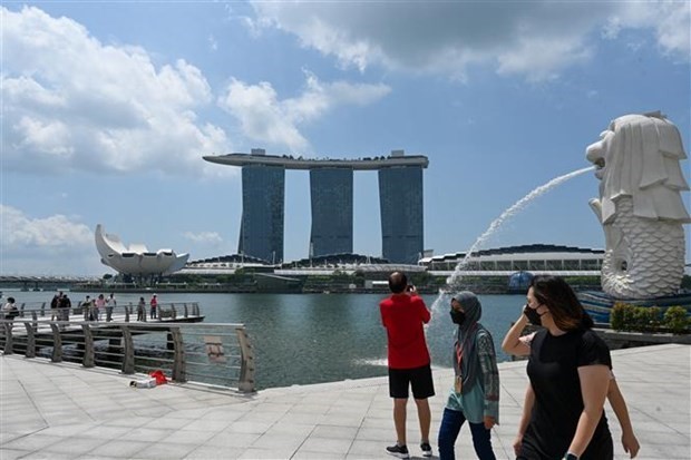 Visitantes en Singapur (Fotografía: AFP)