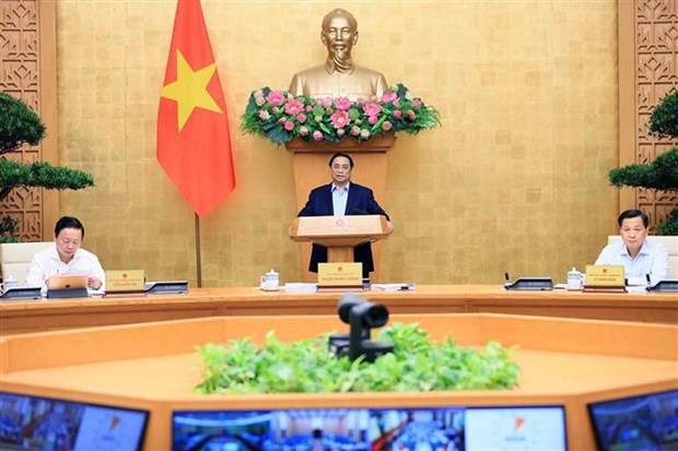 El primer ministro, Pham Minh Chinh, preside la reunión (Fotografía: VNA)