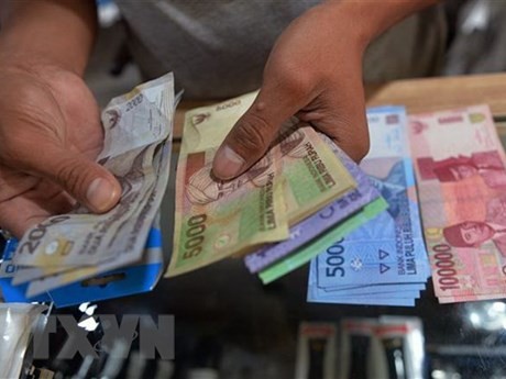 Moneda rupia indonesia. (Foto: AFP/VNA)