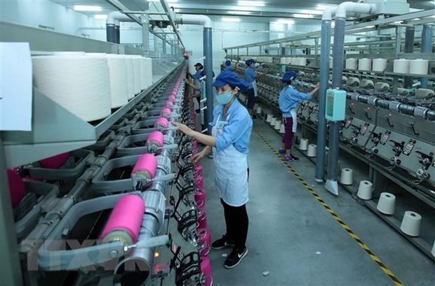 En una planta de producción textil. (Foto: VNA)