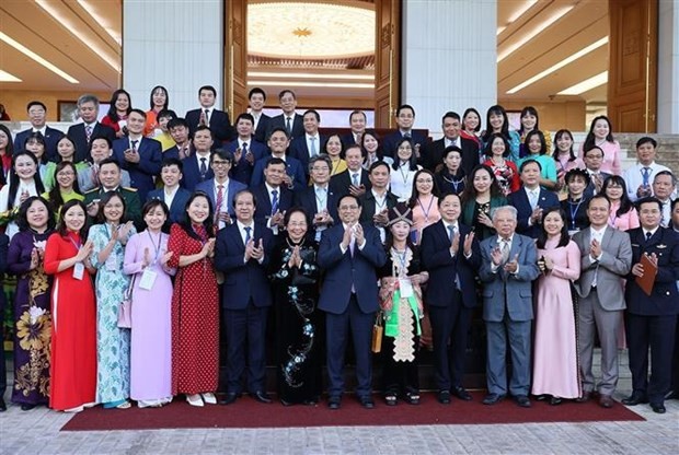 El primer ministro Pham Minh Chinh y delegados en el evento. (Foto: Nhan Dan)