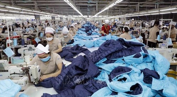 Trabajadores de la compañía de confecciones Tinh Loi en la provincia de Hai Duong. (Foto: VNA)