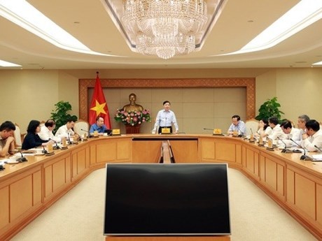 El viceprimer ministro Tran Hong Ha conduce la reunión. (Foto: VGP)