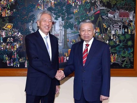 El general To Lam (derecha) y el ministro principal de alto nivel y ministro coordinador de Seguridad Nacional de Singapur, Teo Chee Hean (Fuente: VNA)