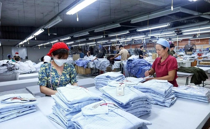 Producción de prendas de vestir para las exportaciones. (Fotografía: VNA)