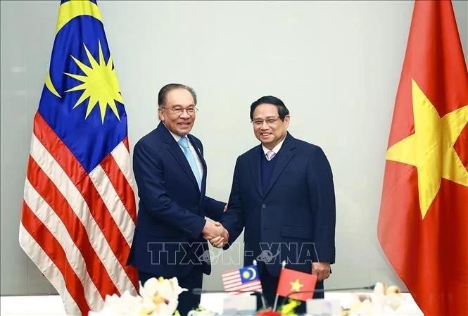 El primer ministro de Vietnam, Pham Minh Chinh y su homólogo malasio Anwar Ibrahim. (Foto: VNA)