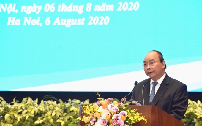 El primer ministro Nguyen Xuan Phuc pronuncia el discurso inaugural del evento. (Fotografía: Nhan Dan)