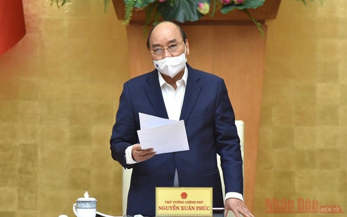 El primer ministro Nguyen Xuan Phuc interviene en la reunión. (Fotografía: Nhan Dan)