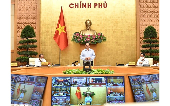 El primer ministro Pham Minh Chinh habla en la reunión. (Fotografía: Nhan Dan)