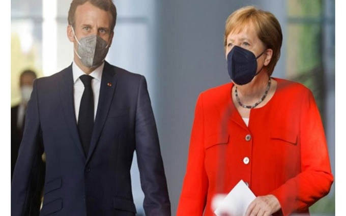 El presidente francés, Emmanuel Macron, y la canciller alemana, Angela Merkel, se preparan para una conferencia de prensa conjunta después de las conversaciones sostenidas el 18 de junio en Berlín, Alemania. (Fotografía: Reuters)