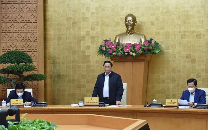 El primer ministro Pham Minh Chinh (de pie) en la reunión. (Fotografía: Nhan Dan)