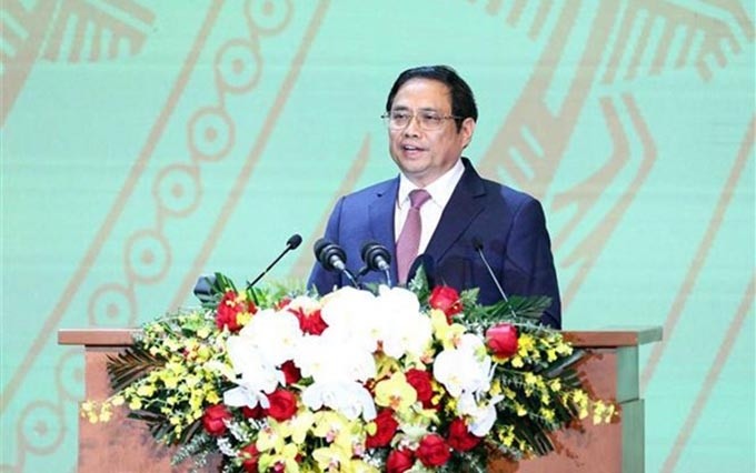 El primer ministro de Vietnam, Pham Minh Chinh, habla en el evento. (Fotografía: VNA)