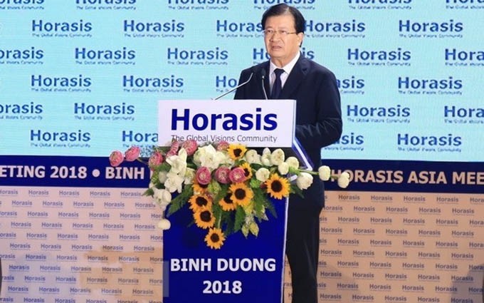 El vicepremier Trinh Dinh Dung interviene en el evento. (Fuente: VNA)
